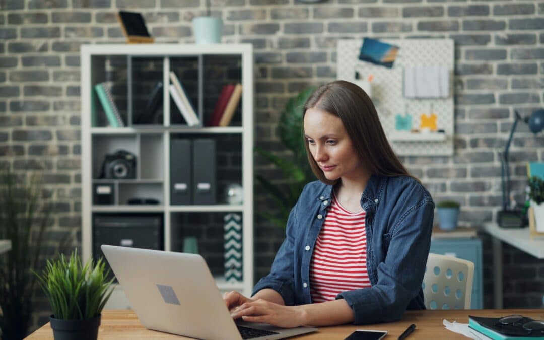 Remote hiring team concept with professional woman working on laptop in modern office